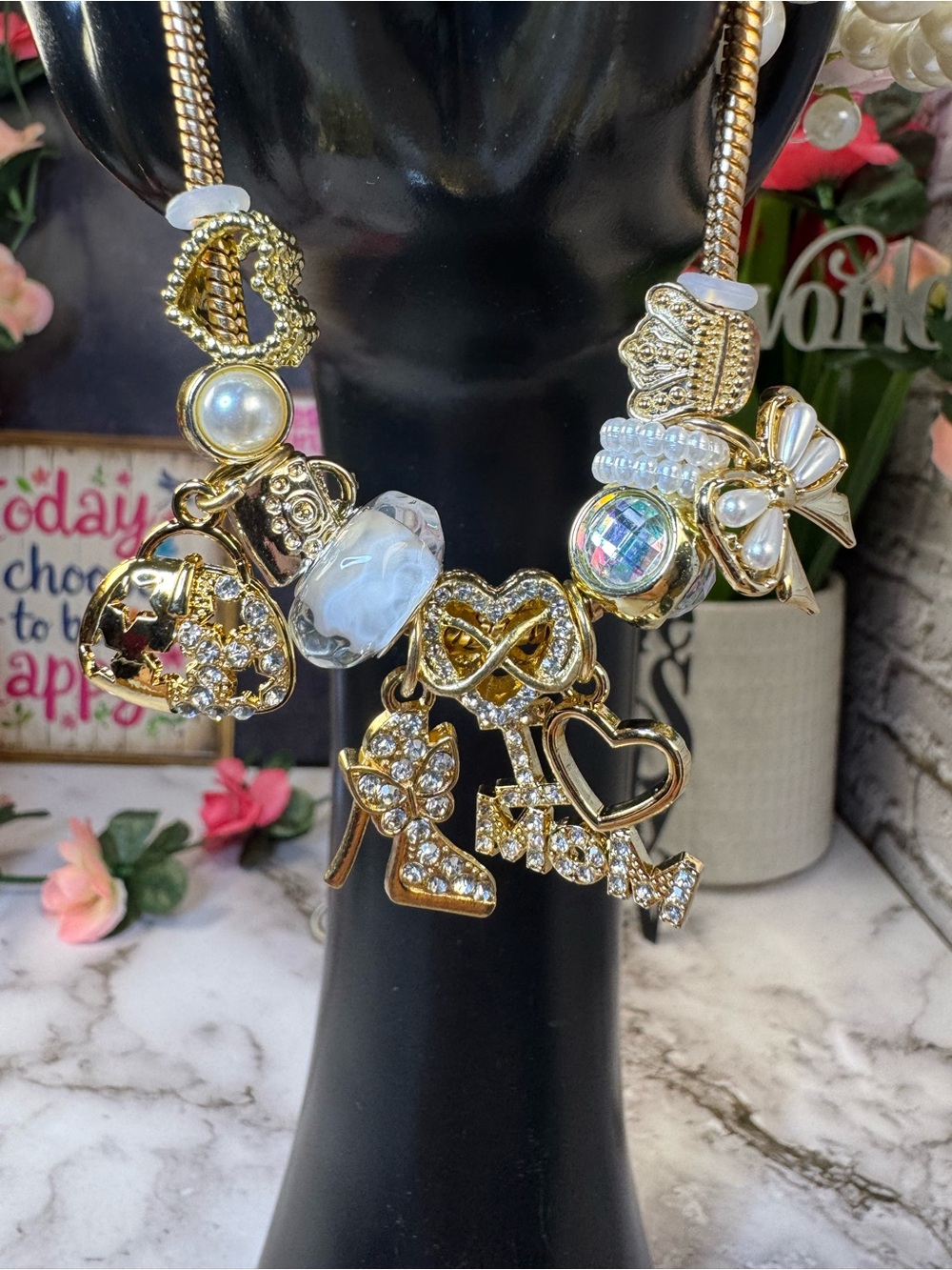 Gold Charm Bracelet with White and Iridescent Accents